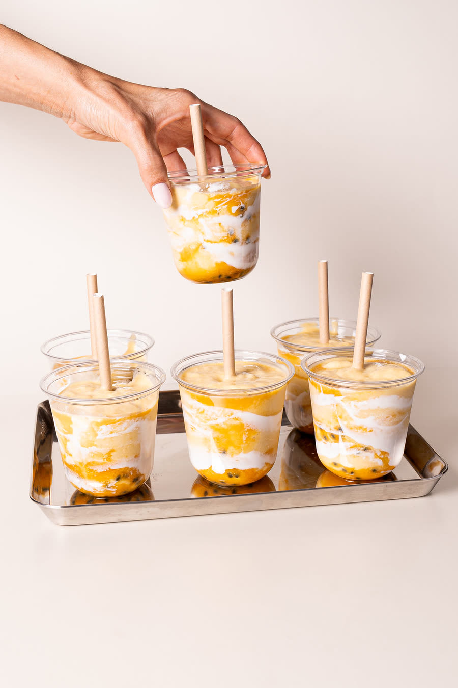Mango passionfruit drinks on a tray