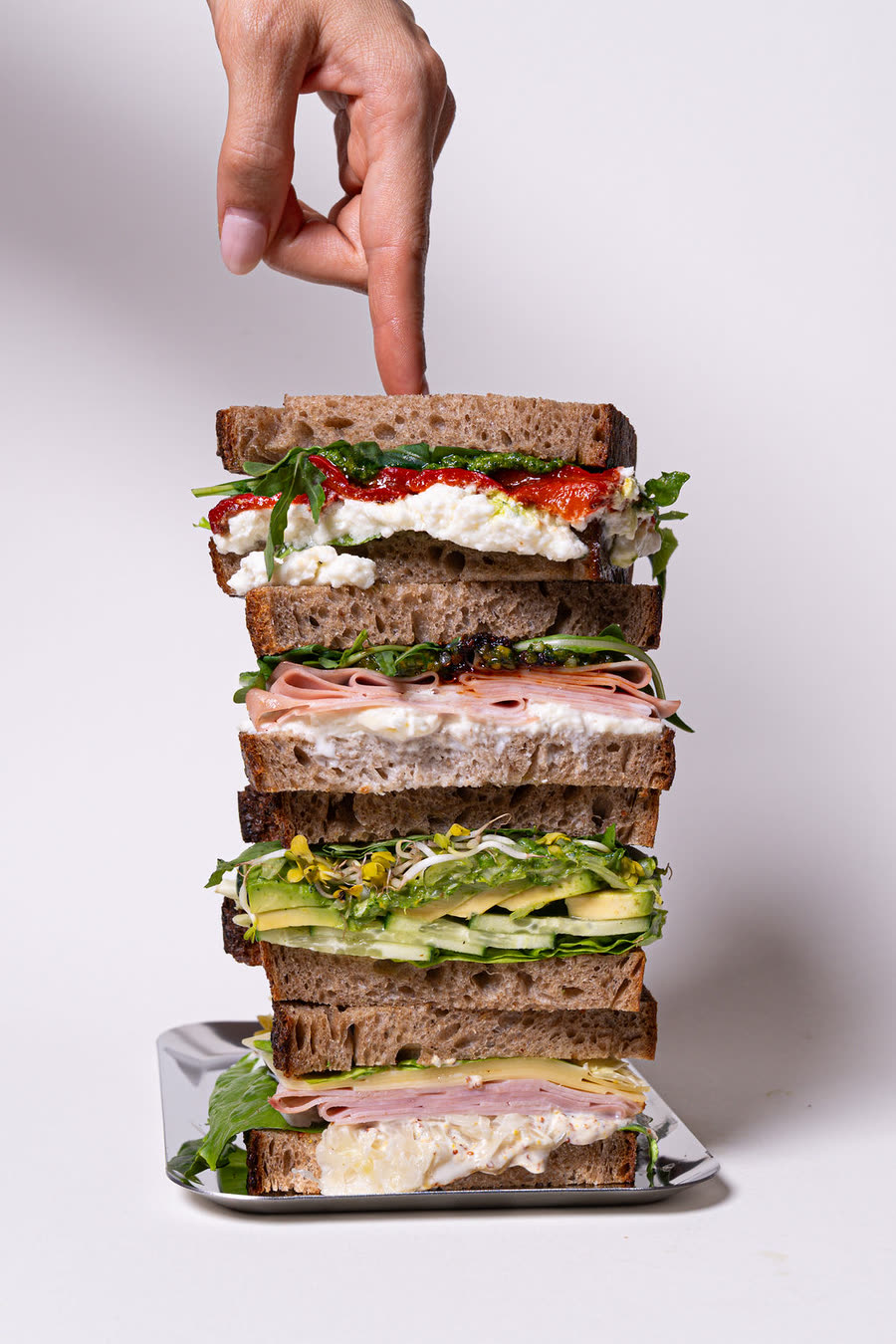 Stacked sandwiches on a tray